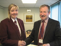 Student presented with award from Principal Ken Fraser